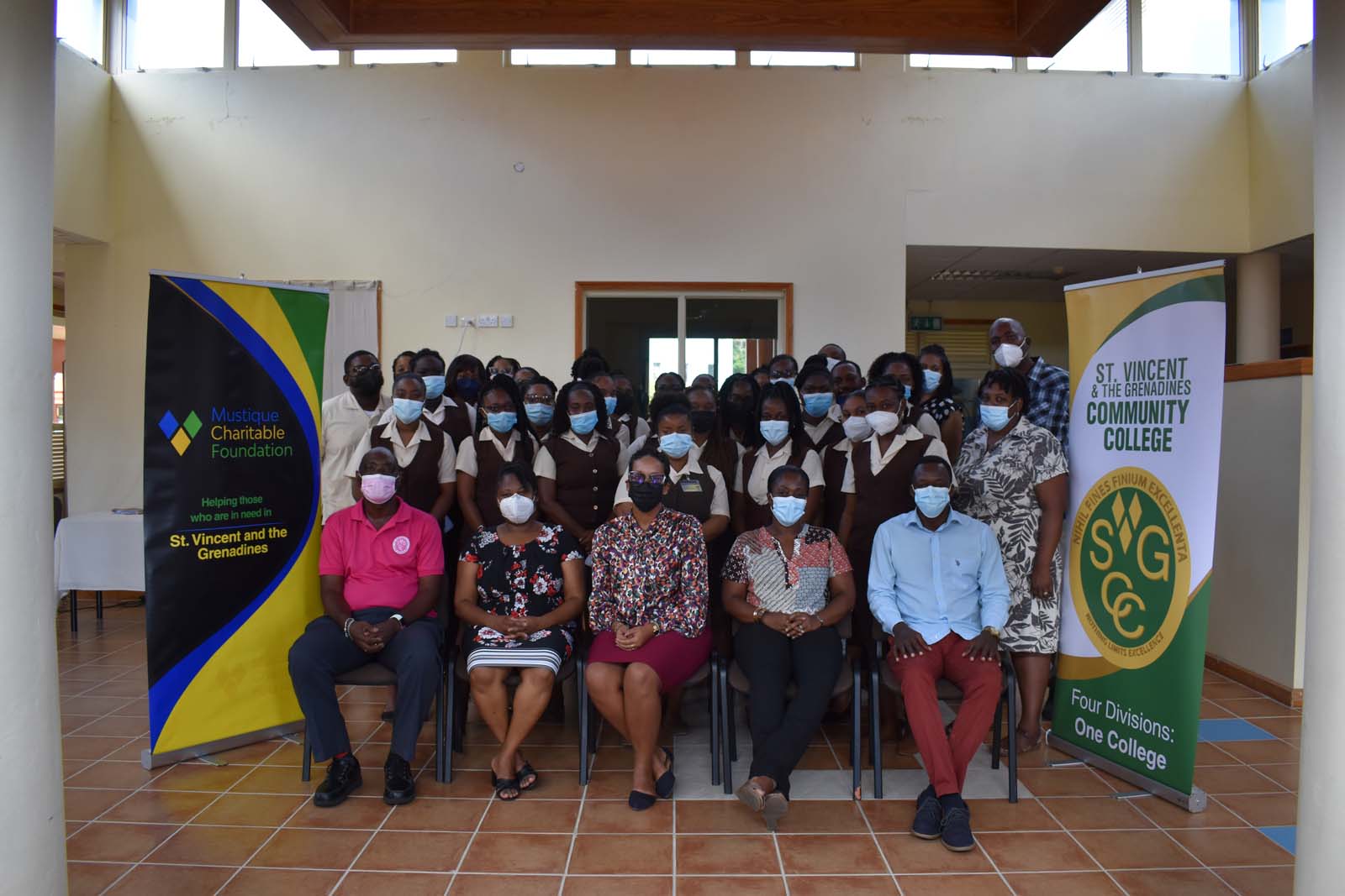 L-R sitting: Nigel Scott (Director – SVGCC), S. Marise Butler (Dean – Division of Teacher Education, SVGCC), Natalia Gill (Project Director – Mustique Charitable Foundation), Anne Dopwell (Lecturer – Division of Teacher Education, SVGCC) and Kenrick Chambers (Bursar – SVGCC